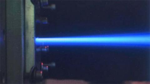 Macro-external beam developed by means of using thin foils in apertures engraved at the back flange of the irradiation chamber